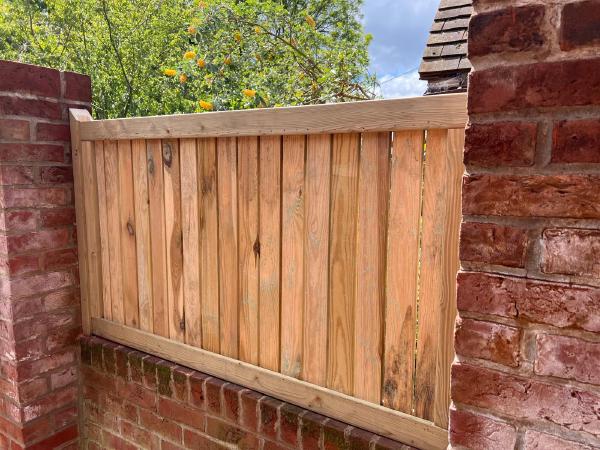 New wooden fencing for a garden and patio