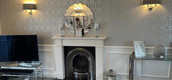 Living room wall panelling and wallpaper