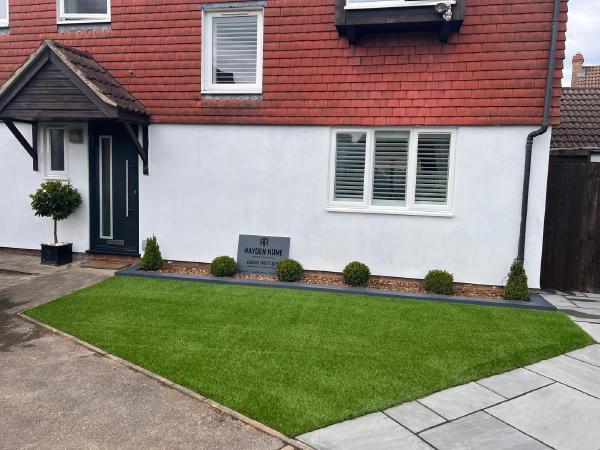 Revitalized front garden with new grass